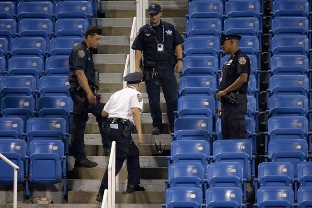 Cops respond to the site of a crashed drone at the US Open in 2015